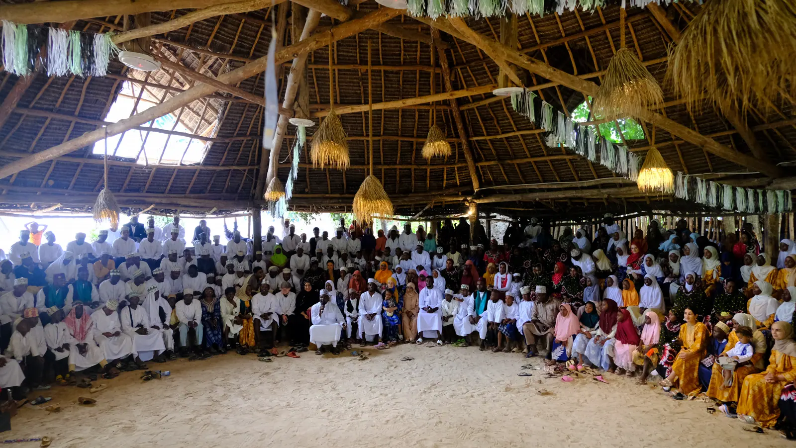 Community members gathered together during an Assalam programme