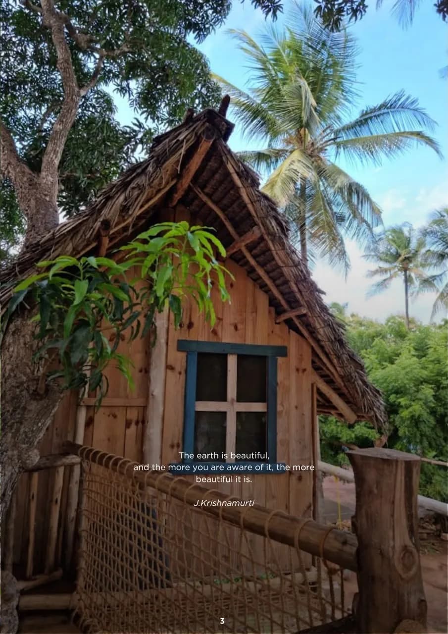A traditional timber and Makuti building surrounded by trees at the Living PEACE Village